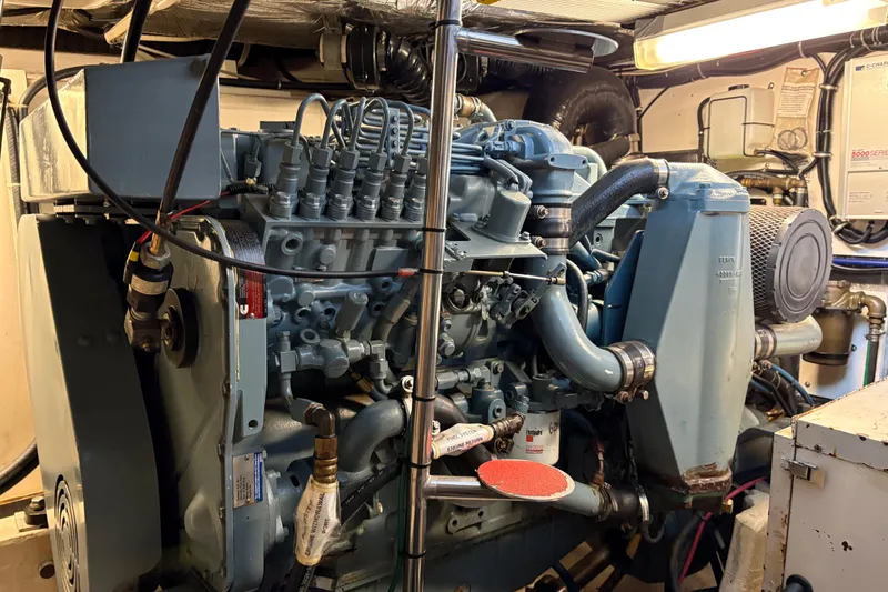 Slide: The Image of Engine room of a 1999 Tiara Yachts 4000 Express, showcasing detailed machinery. - 16