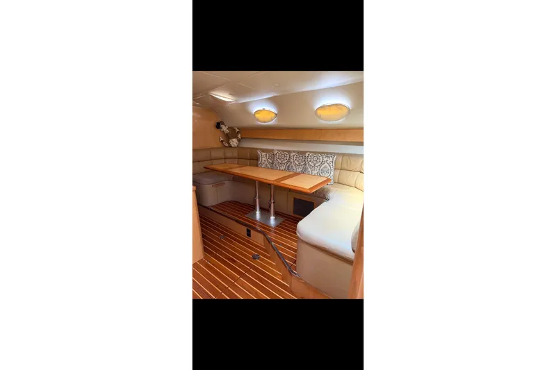 Slide: The Image of Engine room of a 1999 Tiara Yachts 4000 Express, showcasing detailed machinery. - 27