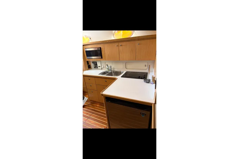 Slide: The Image of Engine room of a 1999 Tiara Yachts 4000 Express, featuring a Diamond Performance Series engine. - 28