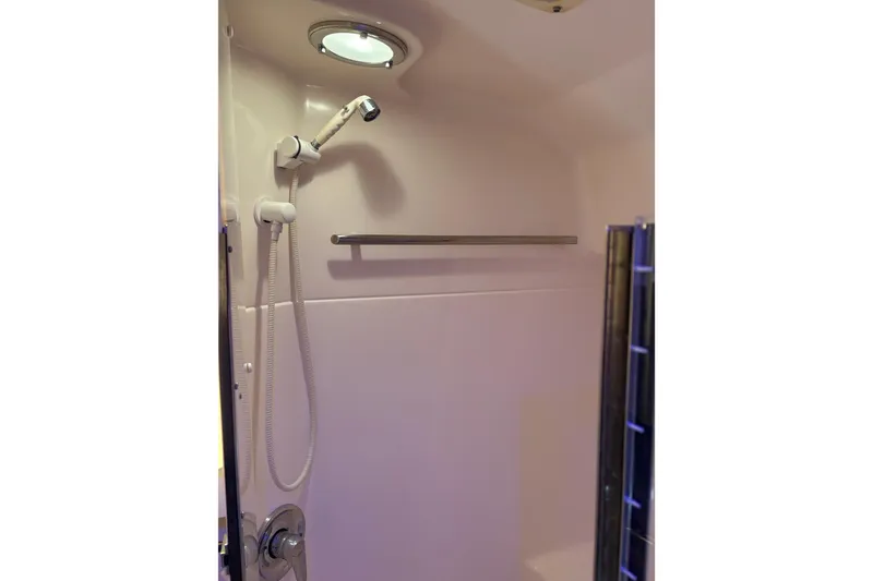 Slide: The Image of Shower area in 1999 Tiara Yachts 4000 Express, featuring modern fixtures and lighting. - 33