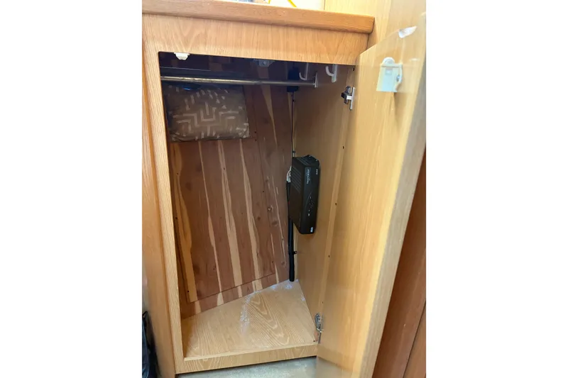 Slide: The Image of Wooden cabinet interior on a 1999 Tiara Yachts 4000 Express. - 38