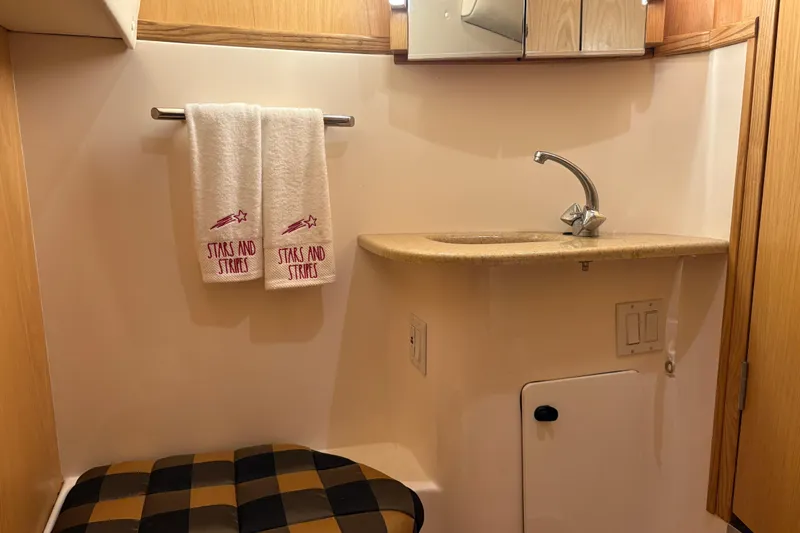 Slide: The Image of Interior of 1999 Tiara Yachts 4000 Express with luxurious white seating. - 7