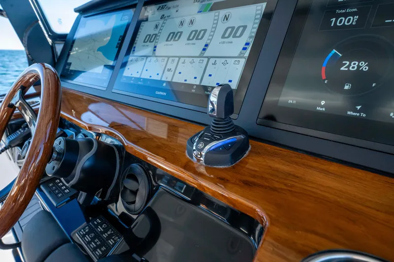 Slide: The Image of 2026 Everglades 455 Center Console helm with modern displays. - 11