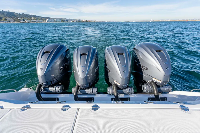 Slide: The Image of Everglades 455 Center Console 2026 with four outboard engines on the water. - 13