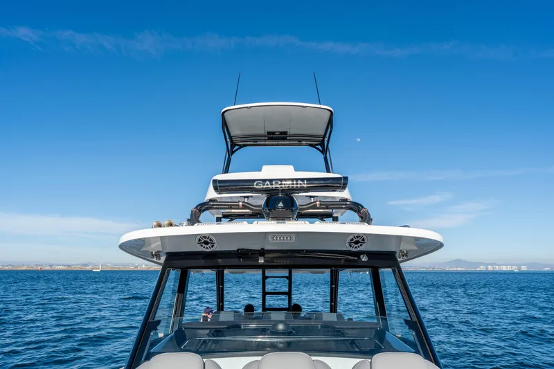 Slide: The Image of Everglades 455 Center Console 2026 on open sea under blue sky. - 15