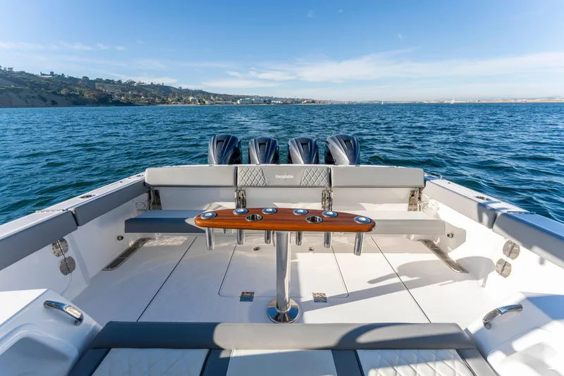 Slide: The Image of Everglades 455 Center Console 2026 on open water with four engines. - 26