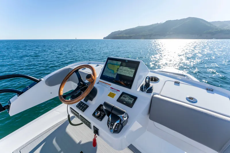 Slide: The Image of Everglades 455 Center Console 2026 helm on open sea. - 37