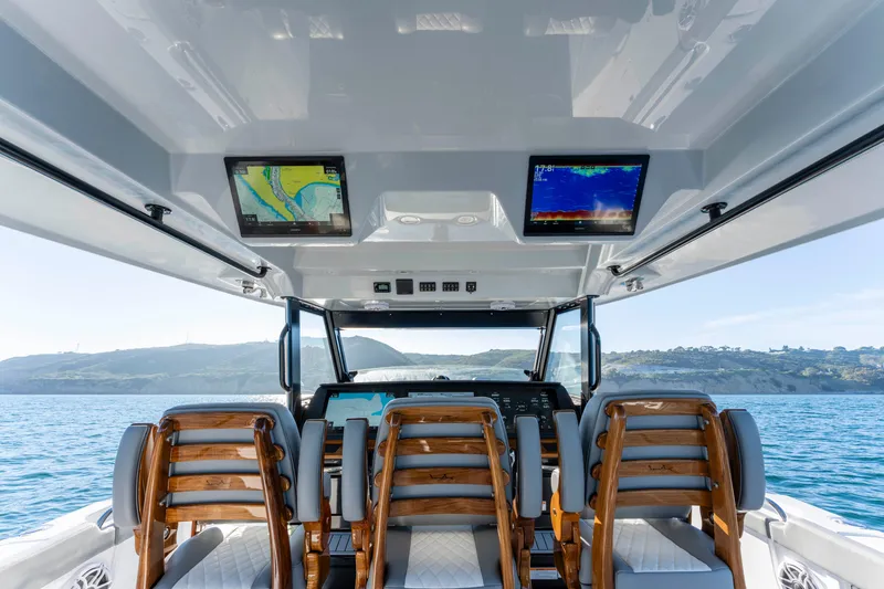 Slide: The Image of Interior view of Everglades 455 Center Console 2026 on the water. - 38
