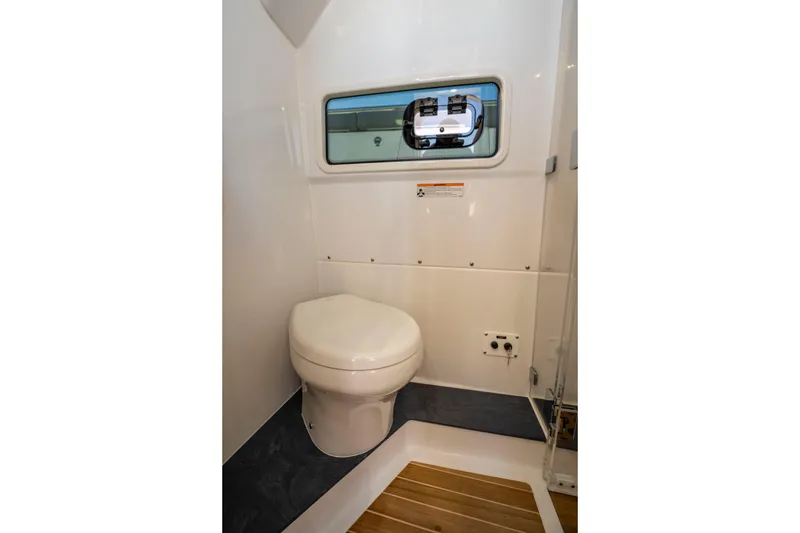 Slide: The Image of Interior of Everglades 455 Center Console 2026 with toilet. - 53