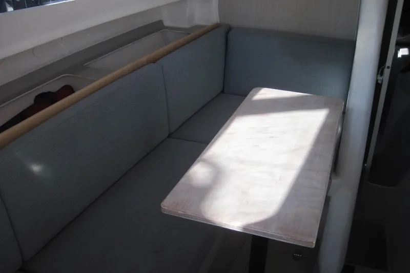 Slide: The Image of Interior of 2022 Corsair 880 Standard, featuring a cozy seating area with a wooden table. - 20