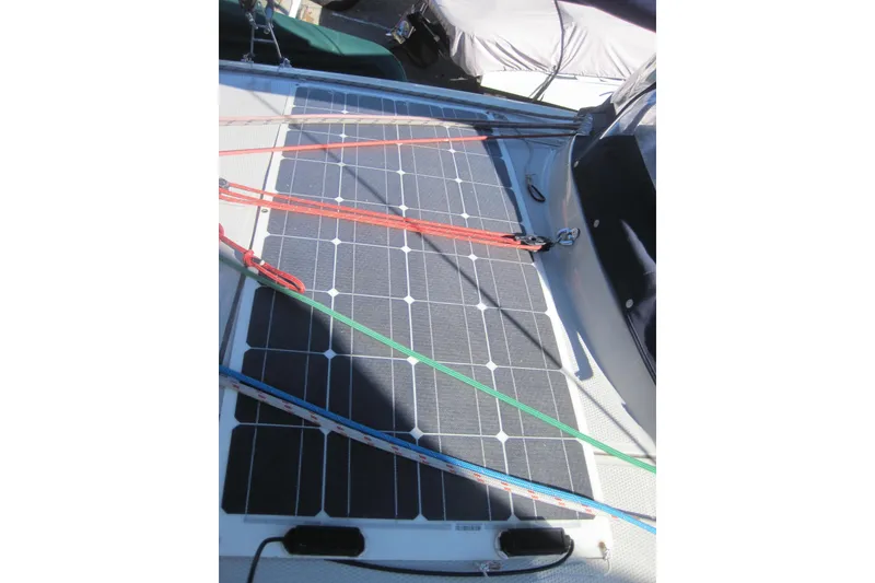 Slide: The Image of Solar panel on 2022 Corsair 880 Standard sailboat deck with colorful ropes. - 7