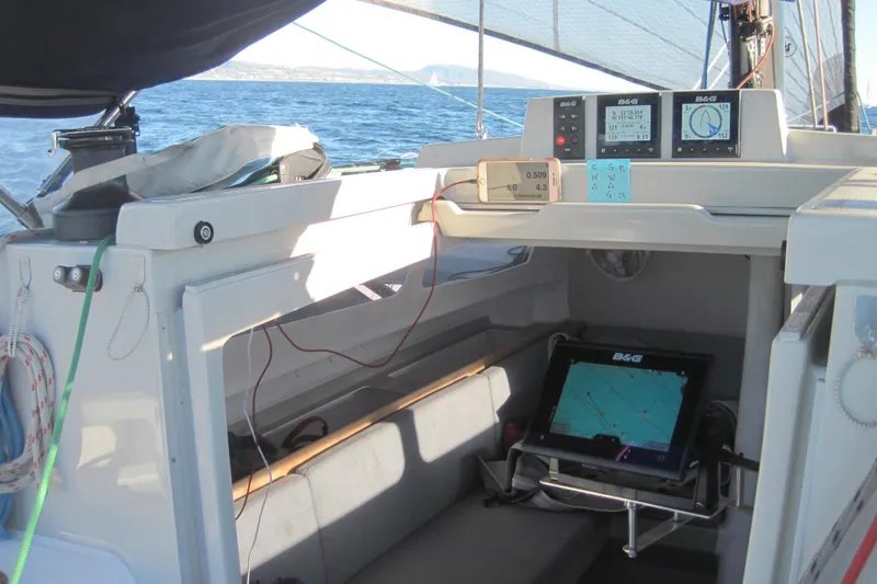 Slide: The Image of Cockpit of 2022 Corsair 880 Standard sailboat with navigation equipment and ocean view. - 9