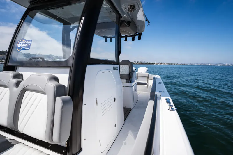 Slide: The Image of 2025 Everglades 285 Center Console boat on calm ocean waters. - 15