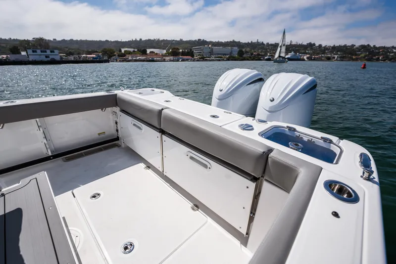 Slide: The Image of 2025 Everglades 285 Center Console boat with dual engines on a sunny day. - 21