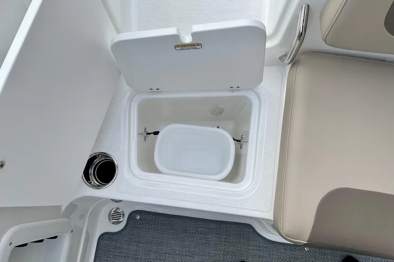 Slide: The Image of 2026 Tahoe 2150 boat interior with open storage compartment and seating. - 11