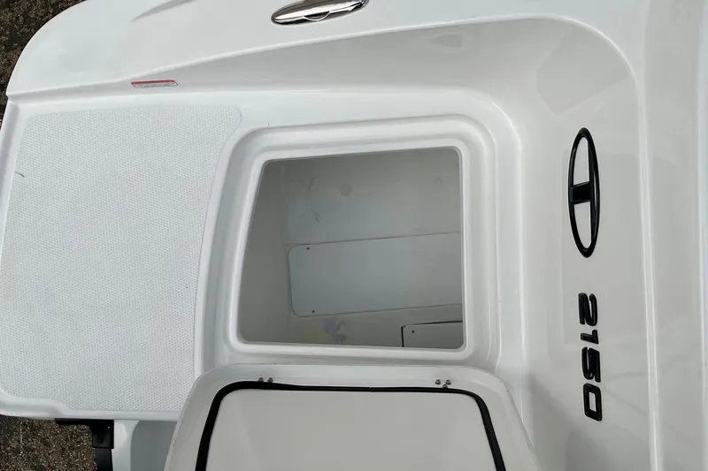 Slide: The Image of 2026 Tahoe 2150 boat storage compartment with sleek white design. - 8