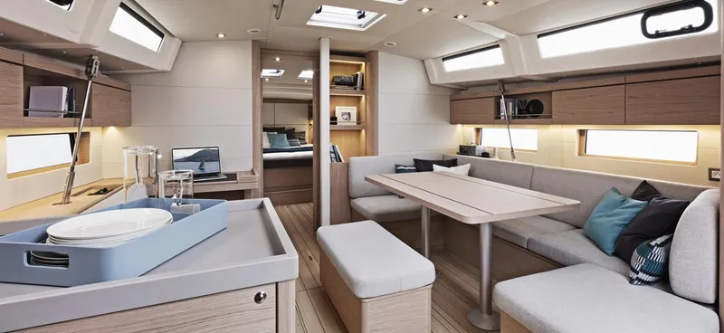 Slide: The Image of Luxurious interior of 2020 Beneteau Oceanis 46.1 yacht, featuring modern kitchen and spacious seating area. - 11