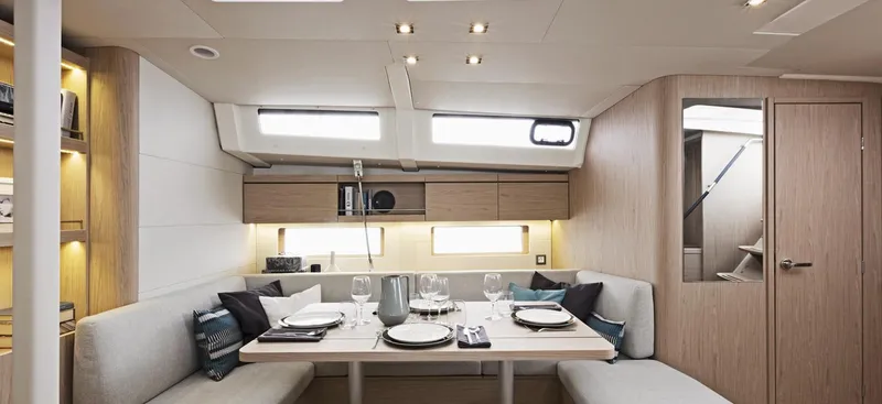 Slide: The Image of Interior of 2020 Beneteau Oceanis 46.1 yacht with elegant shelving and coral decor. - 12