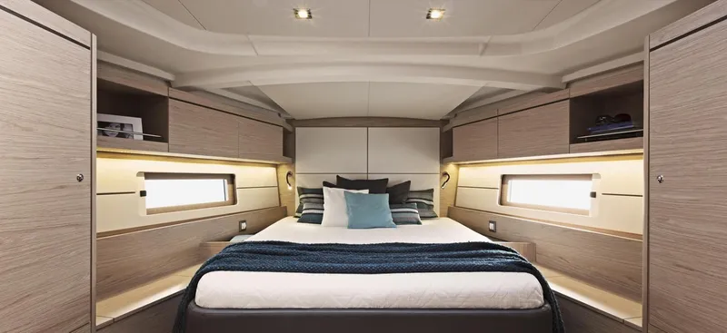 Slide: The Image of Interior of 2020 Beneteau Oceanis 46.1 yacht with modern furnishings and a cozy bedroom. - 14