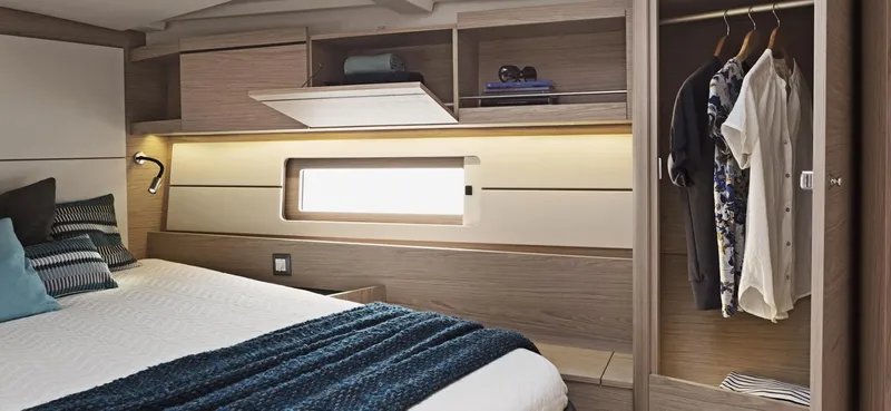 Slide: The Image of Interior of 2020 Beneteau Oceanis 46.1 yacht, featuring modern kitchen and seating area. - 15