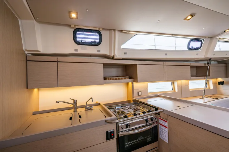 Slide: The Image of Modern kitchen interior of 2020 Beneteau Oceanis 46.1 yacht with stove and sink. - 18