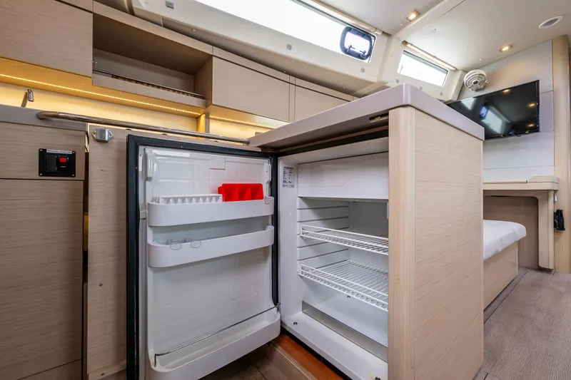 Slide: The Image of Modern kitchen interior of 2020 Beneteau Oceanis 46.1 yacht with open fridge. - 19