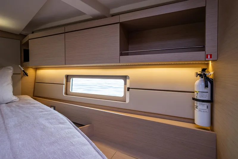Slide: The Image of Interior cabin of 2020 Beneteau Oceanis 46.1 yacht with window and fire extinguisher. - 27