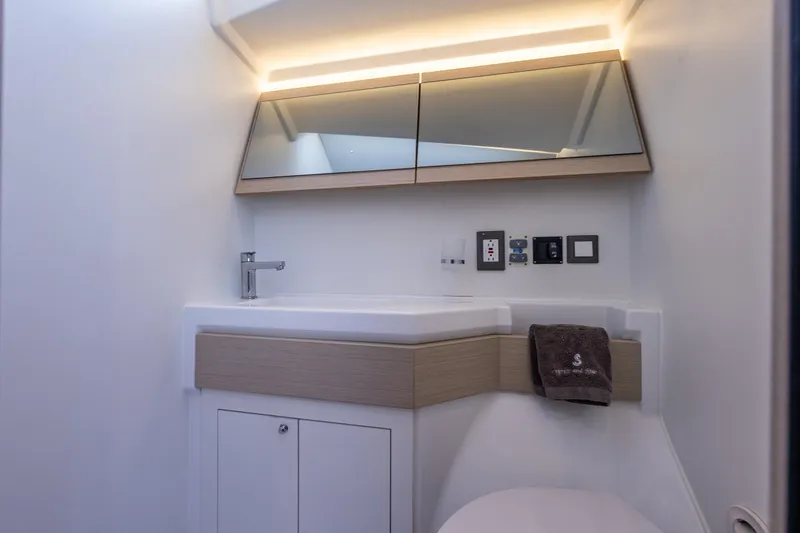 Slide: The Image of Modern bathroom interior of 2020 Beneteau Oceanis 46.1 yacht with sleek fixtures and lighting. - 30