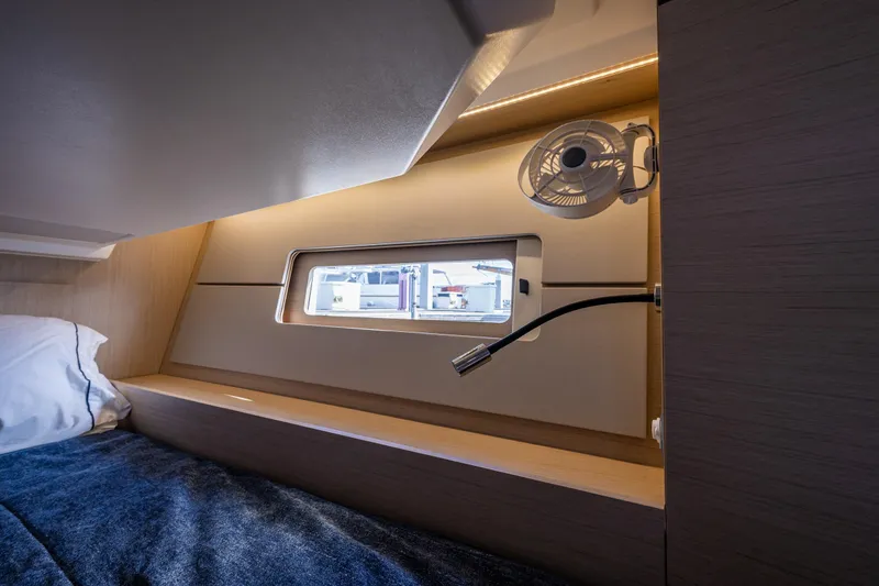 Slide: The Image of Interior cabin of 2020 Beneteau Oceanis 46.1 yacht with window and fan. - 36