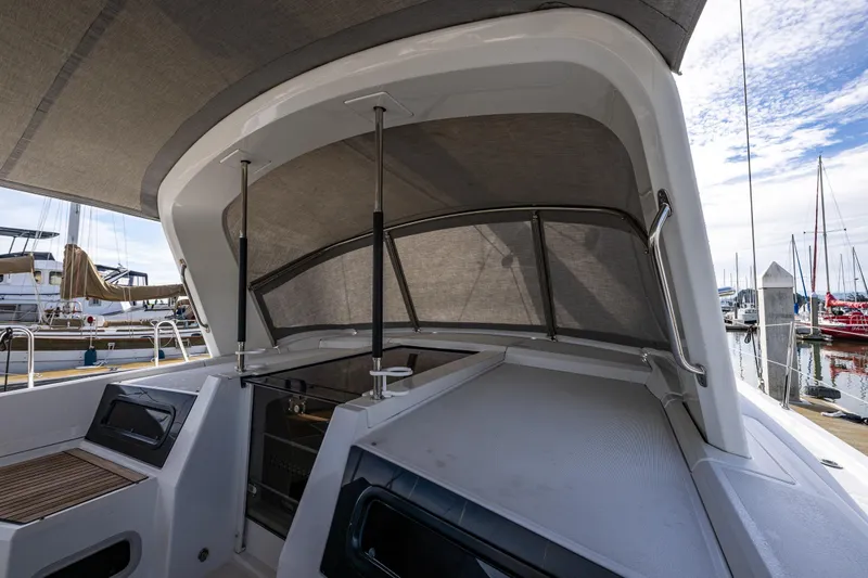 Slide: The Image of Beneteau Oceanis 46.1 cockpit with canopy, docked at marina, 2020 model. - 44