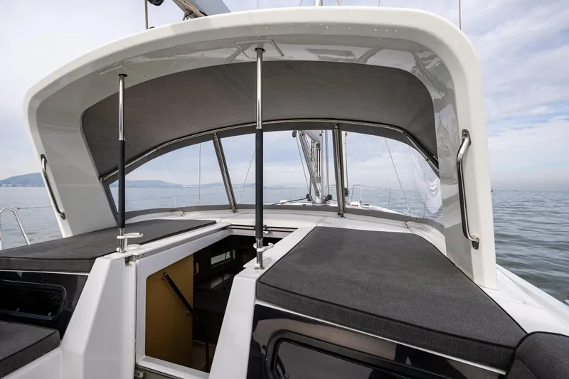 Slide: The Image of 2020 Beneteau Oceanis 46.1 yacht deck with open hatch, calm sea background. - 46