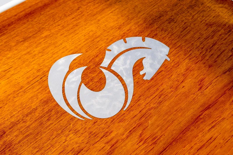 Slide: The Image of Beneteau Oceanis 46.1 logo on polished wood, 2020 model. - 48