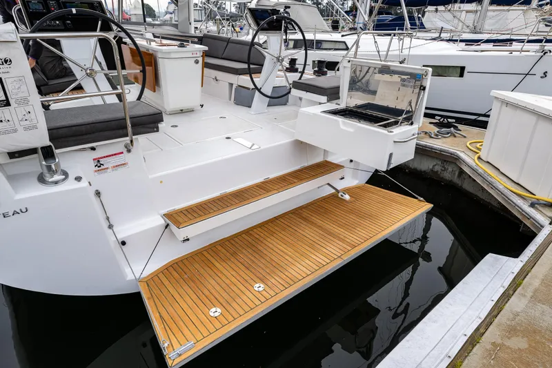 Slide: The Image of 2020 Beneteau Oceanis 46.1 yacht with teak swim platform and outdoor grill. - 51