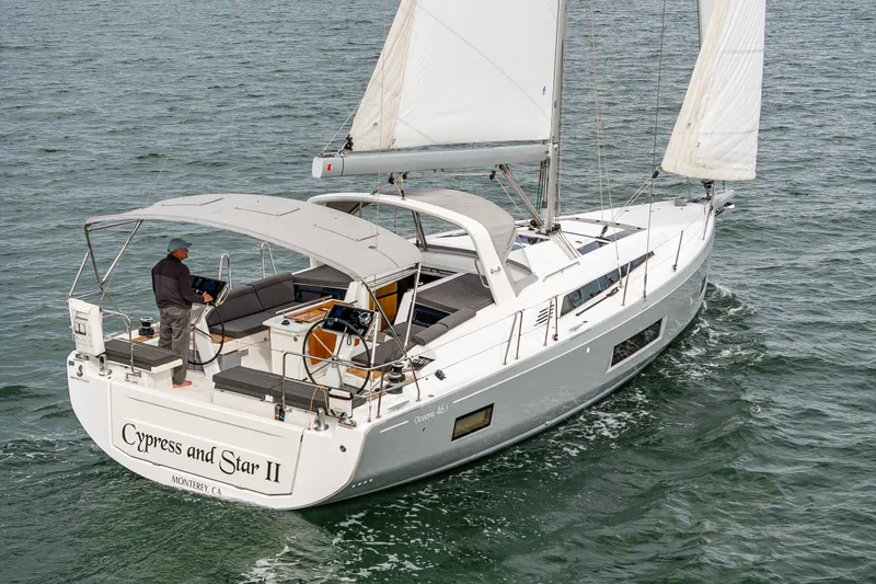 Slide: The Image of 2020 Beneteau Oceanis 46.1 sailing on open water, featuring sleek design and spacious deck. - 63