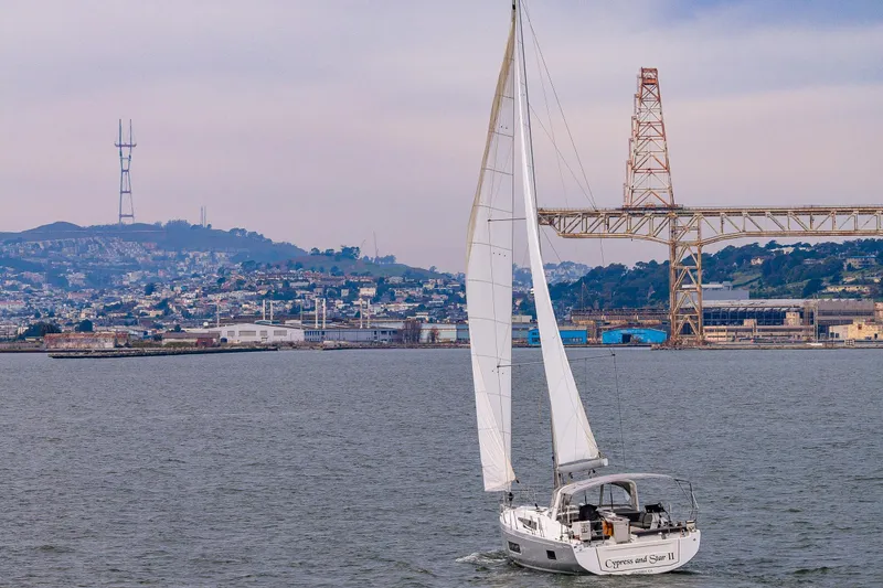 Slide: The Image of Sailing yacht Beneteau Oceanis 46.1, 2020 model, cruising near a cityscape and bridge. - 68