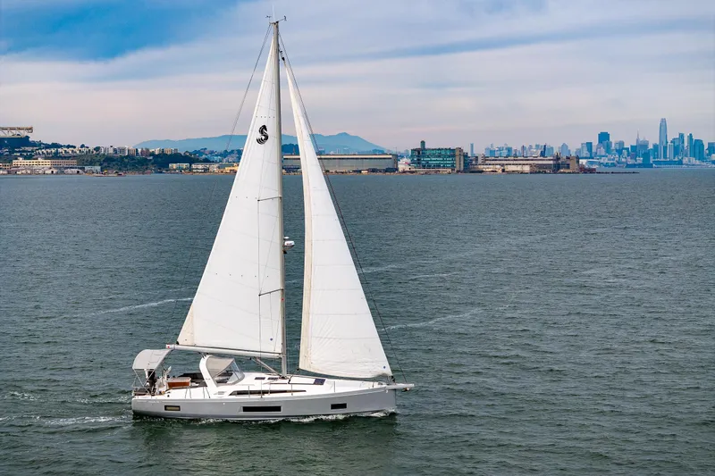 Slide: The Image of 2020 Beneteau Oceanis 46.1 sailing near urban skyline, under clear skies. - 71