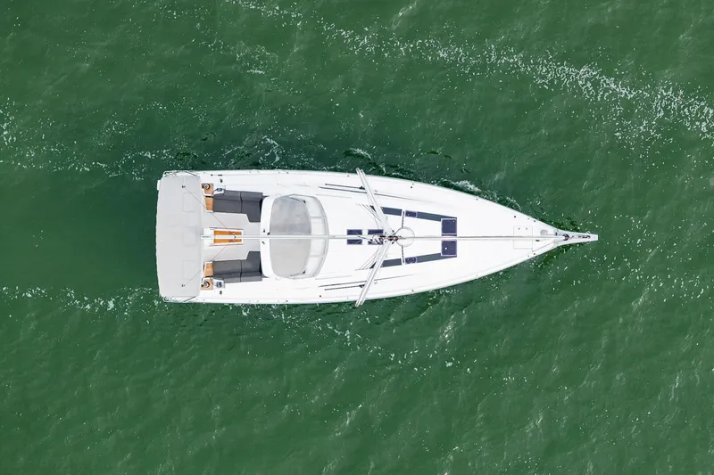 Slide: The Image of Aerial view of 2020 Beneteau Oceanis 46.1 sailing on green water. - 72