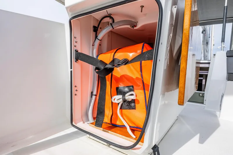Slide: The Image of Storage compartment on 2020 Beneteau Oceanis 46.1 yacht with orange safety equipment. - 79