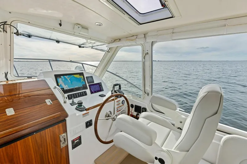 Slide: The Image of Interior of 2025 MJM 35 boat with modern navigation system and ocean view. - 1