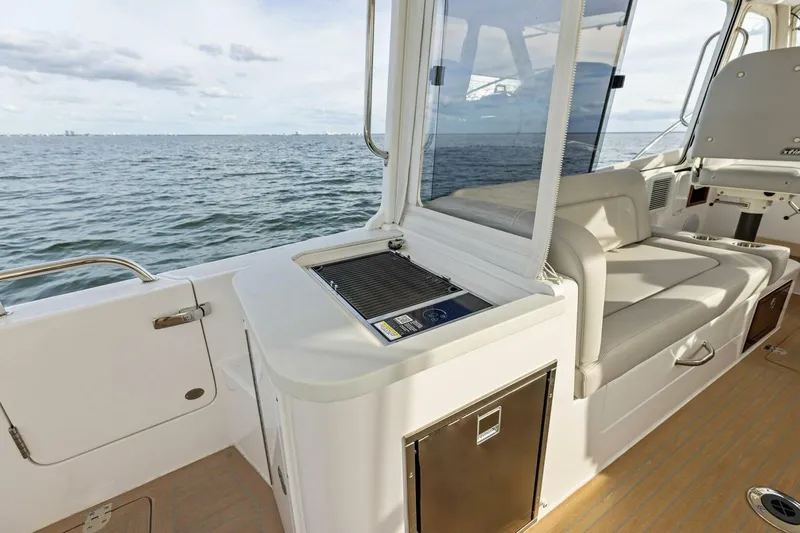Slide: The Image of Luxury MJM 35 yacht interior with seating and ocean view, 2025 model. - 26