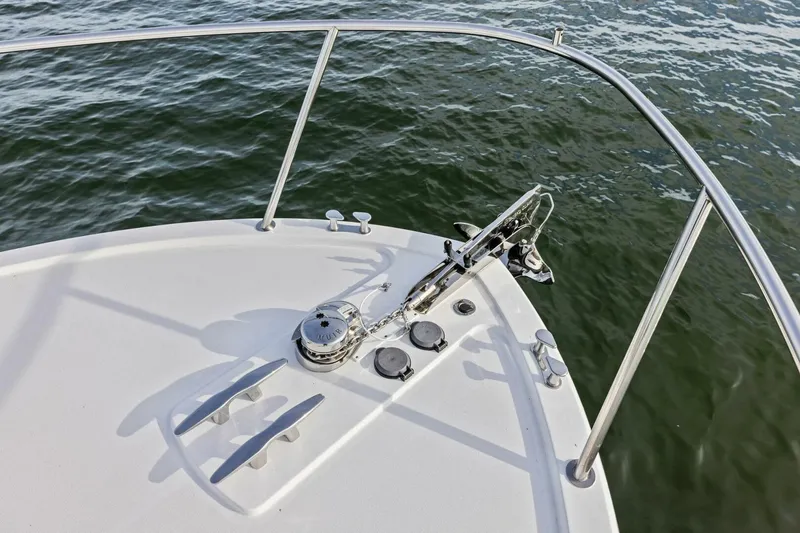 Slide: The Image of Bow of 2025 MJM 35 boat with anchor and railing over water. - 38