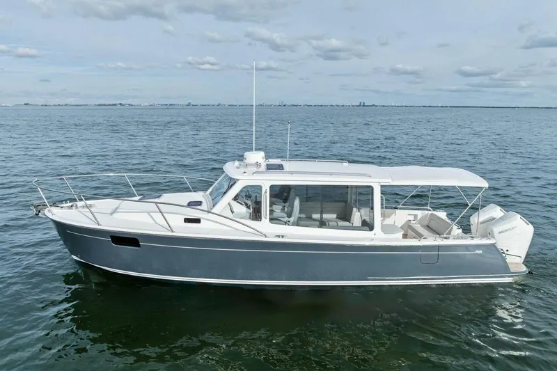 Slide: The Image of 2025 MJM 35 boat on calm water, showcasing sleek design and modern features. - 40