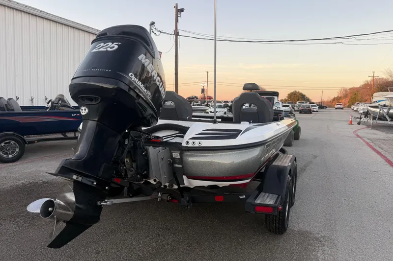 Slide: The Image of 2020 Nitro Z20 boat with Mercury 225 OptiMax engine on trailer in parking lot. - 10