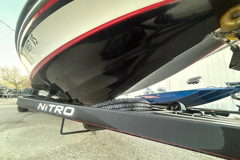 Slide: The Image of 2020 Nitro Z20 boat with Mercury 225 engine on trailer, parked outdoors. - 16