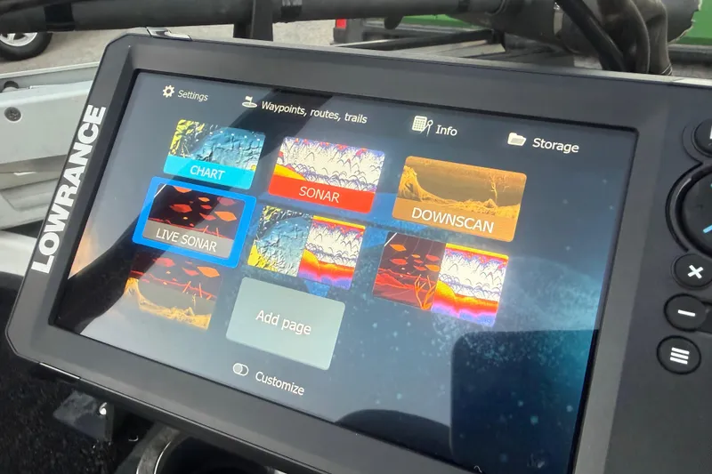 Slide: The Image of 2020 Nitro Z20 boat on trailer by serene lake at sunrise. - 21