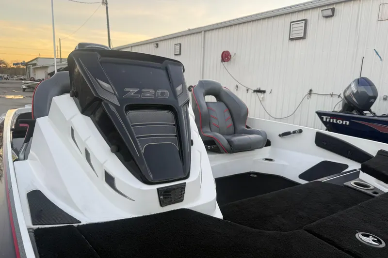 Slide: The Image of 2020 Nitro Z20 boat on trailer by the water, showcasing sleek design. - 22