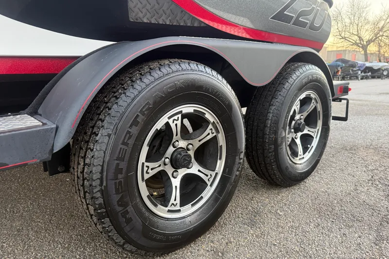 Slide: The Image of 2020 Nitro Z20 boat at sunset by a calm lake. - 26