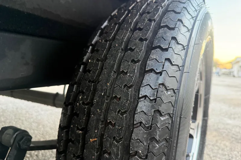 Slide: The Image of 2020 Nitro Z20 boat with Mercury engine at sunset by a lake dock. - 28