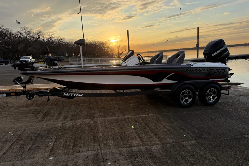 Slide: The Image of Gray and red seat in a 2020 Nitro Z20 boat, featuring sleek design and stitching. - 37