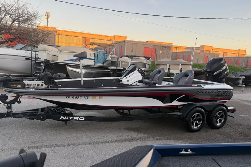 Slide: The Image of 2020 Nitro Z20 boat on trailer at sunset by the water. - 4